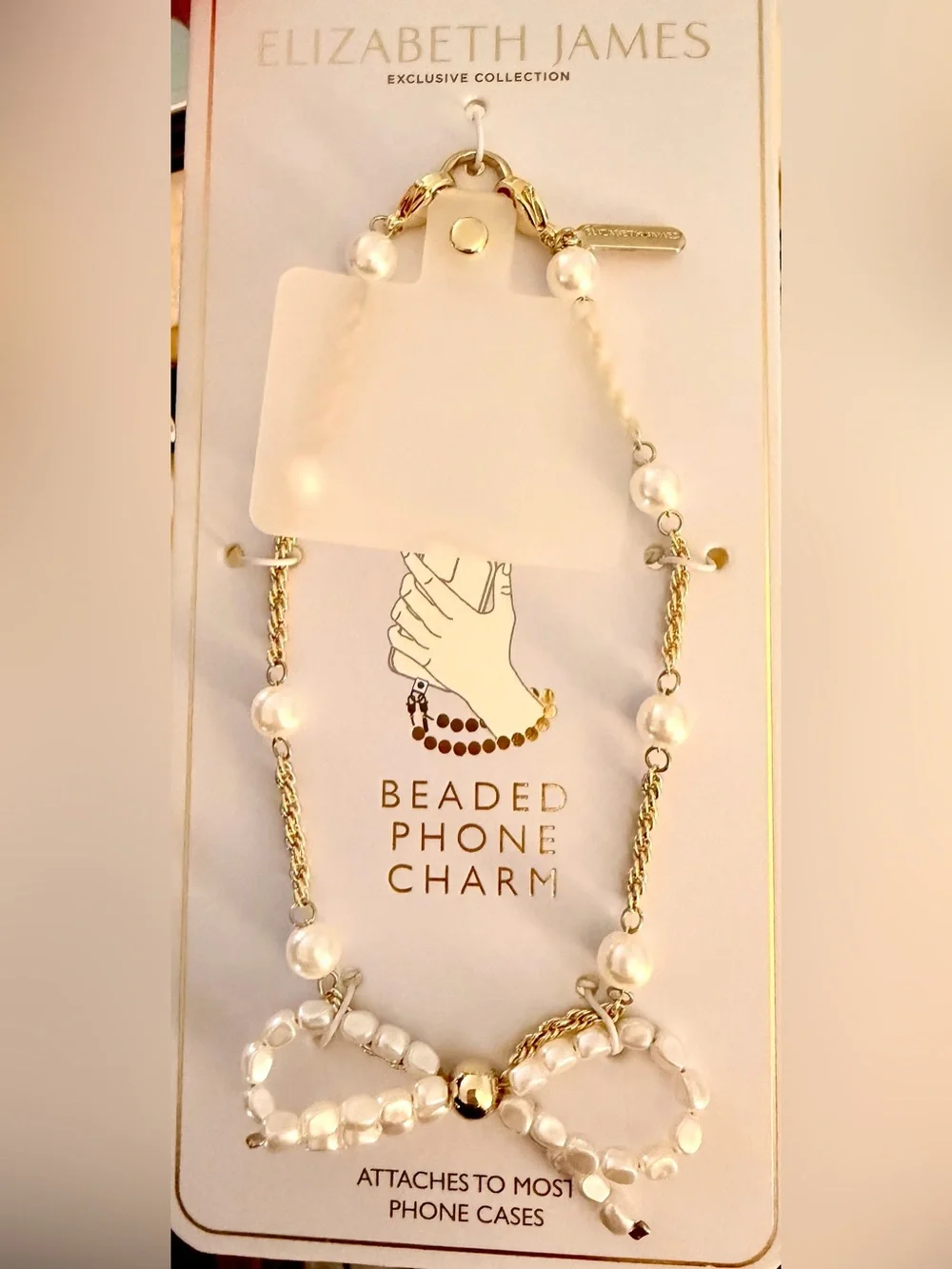 NWT Elizabeth and James Gold and White Beaded Phone Charm Strap w. Bow Detail